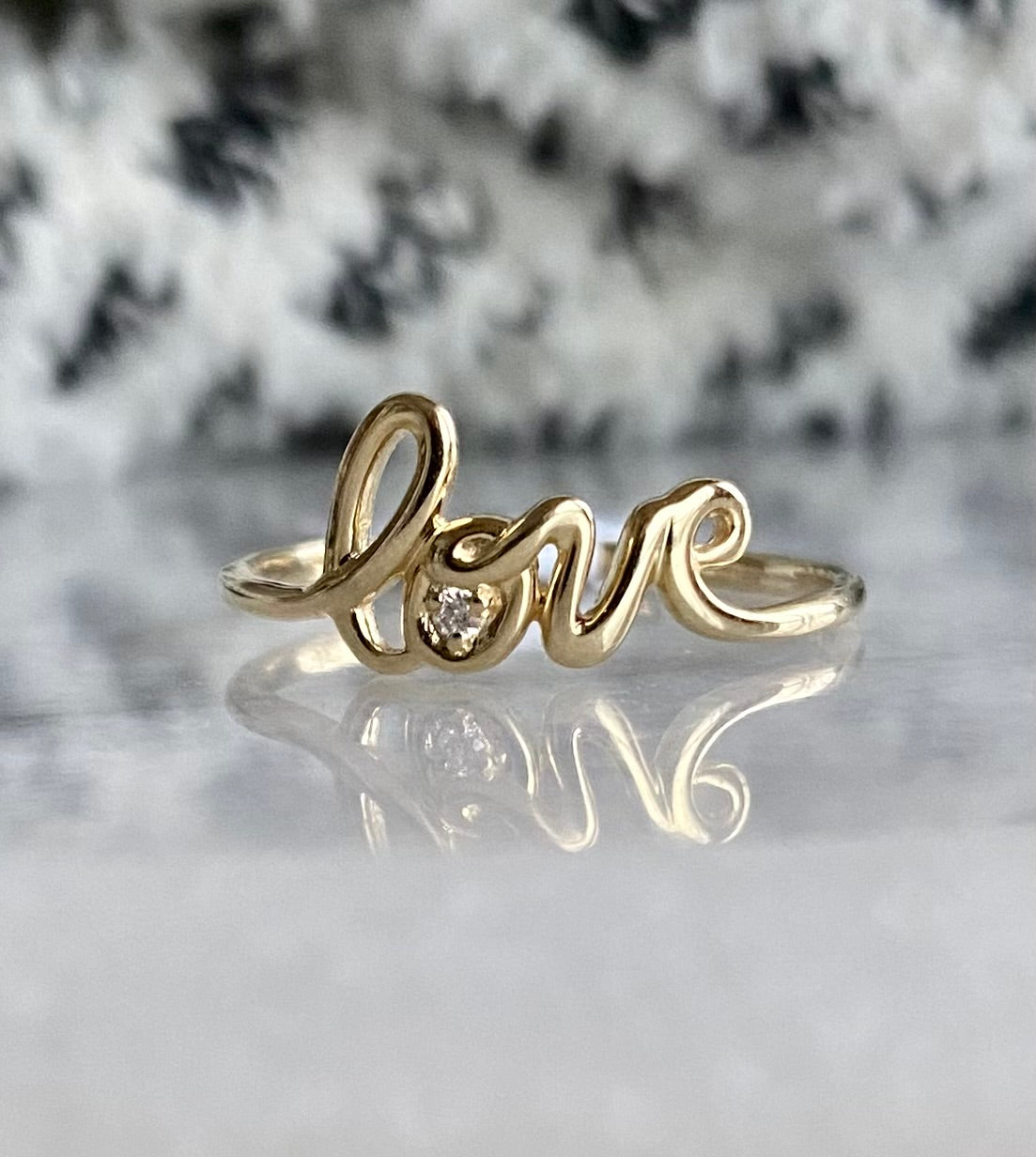 Gold "love" ring